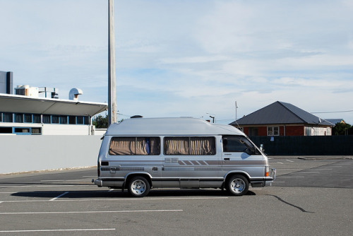 A white van parked in front of a building - Pistonheads