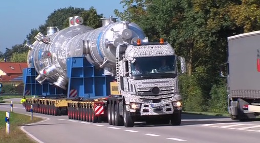 A large semi truck driving down a street - Pistonheads