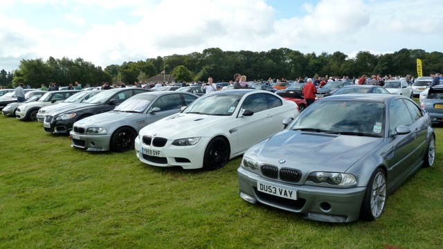 A bunch of cars are parked in a field - Pistonheads