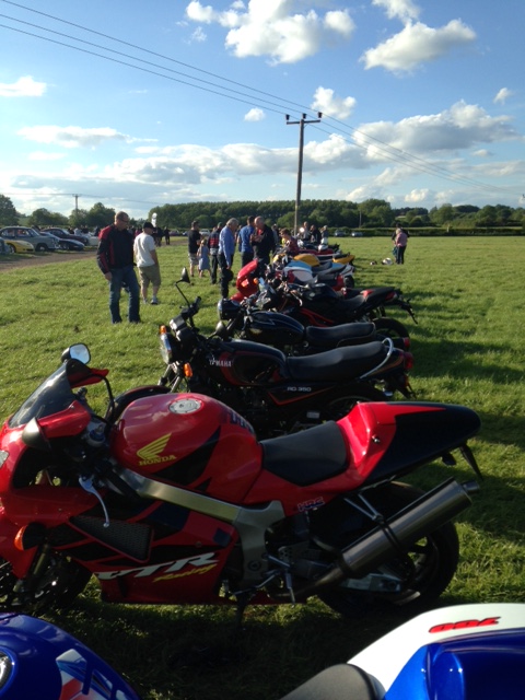 A row of motorcycles parked on the side of a road - Pistonheads