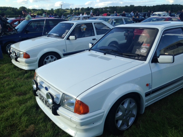 A white car parked in a parking lot - Pistonheads