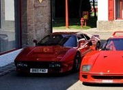 A red car is parked on the side of the street - Pistonheads