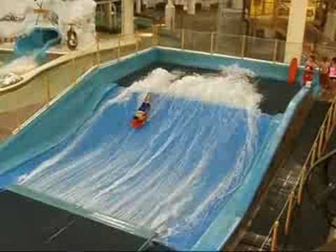 A person riding a surf board on a wave - Pistonheads