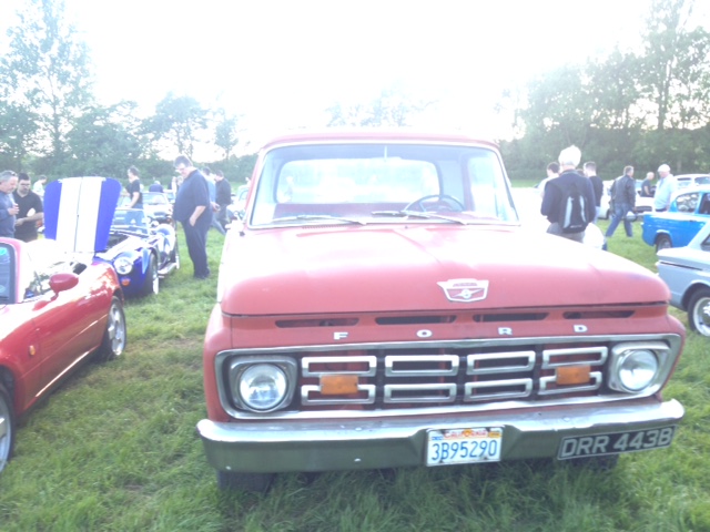 An old red truck is parked in a field - Pistonheads