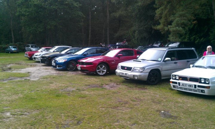 A group of cars parked in a parking lot - Pistonheads