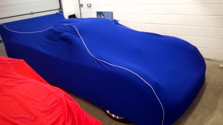 A bed with a blue and white striped bedspread - Pistonheads