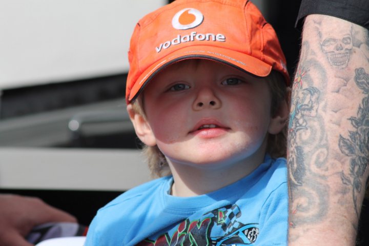 A young boy wearing a baseball hat and a hat - Pistonheads