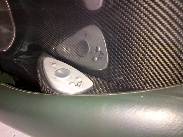 A close up of a remote control on a table - Pistonheads