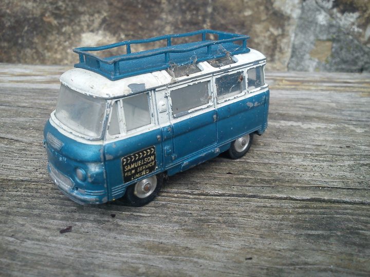 A blue and white bus parked in a parking lot - Pistonheads