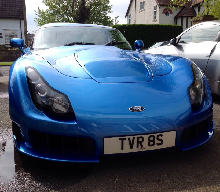 A blue car parked in a parking space - Pistonheads