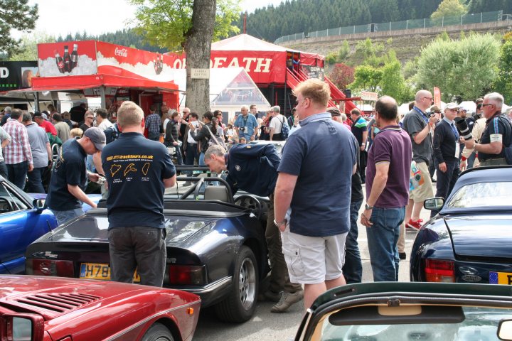 A group of people standing outside of a food truck - Pistonheads