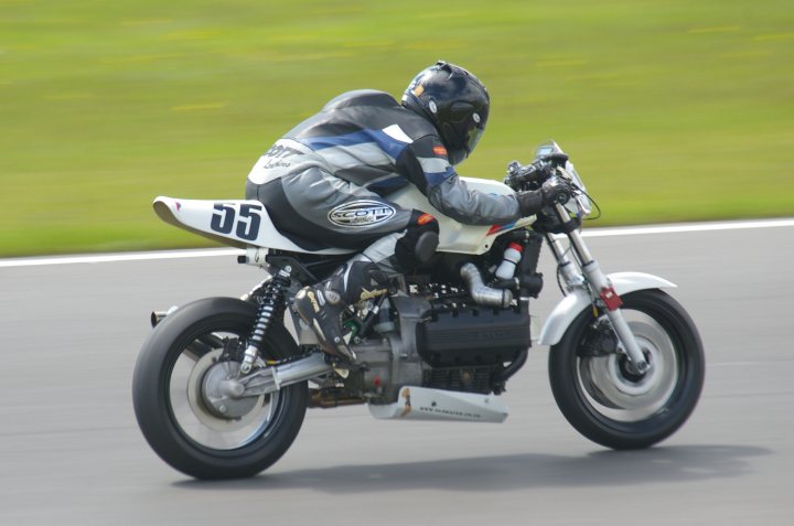 A man riding a motorcycle on a race track - Pistonheads