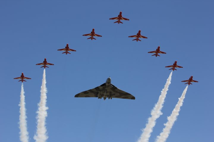 A formation of fighter jets flying through a blue sky - Pistonheads