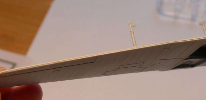 An airplane wing with a plane flying over it - Pistonheads