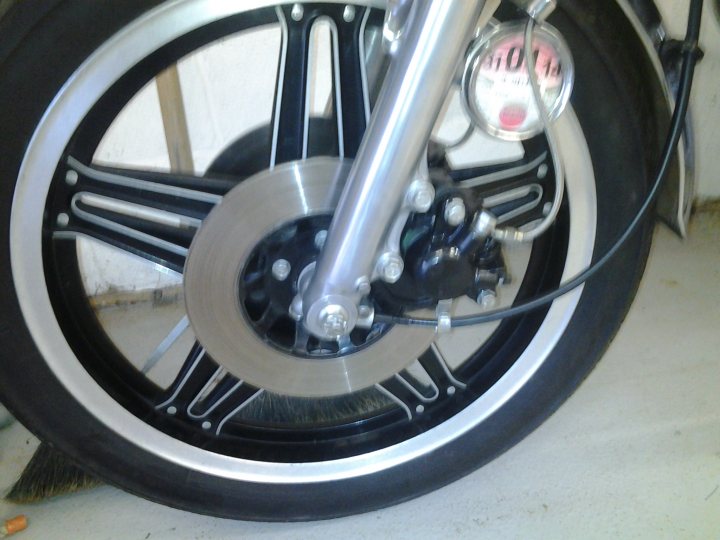 A close up of a motorcycle parked on a tiled floor - Pistonheads