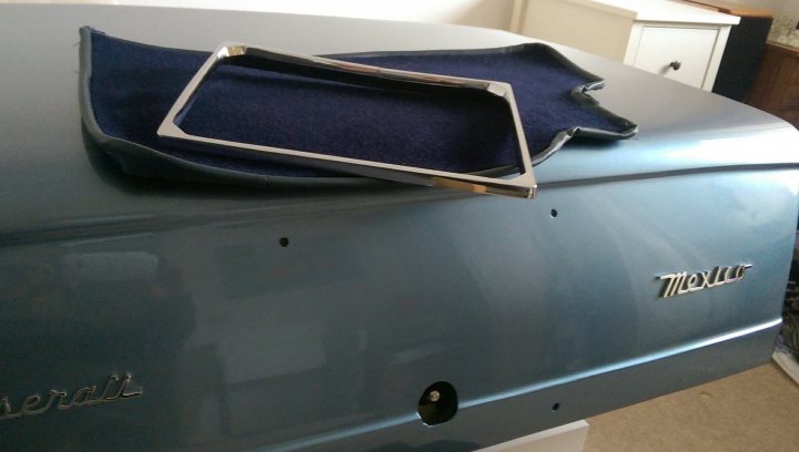 A blue and white suit case sitting on top of a table - Pistonheads