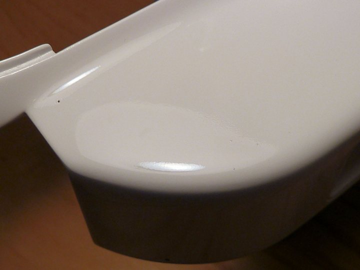 A white toilet sitting next to a bath tub - Pistonheads