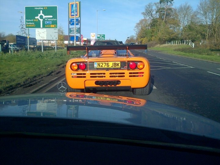 A yellow school bus driving down a street - Pistonheads