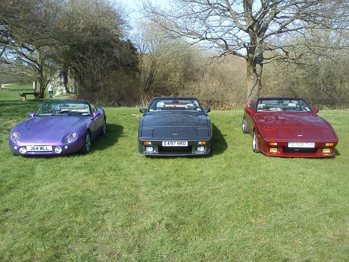 A couple of cars that are sitting in the grass - Pistonheads