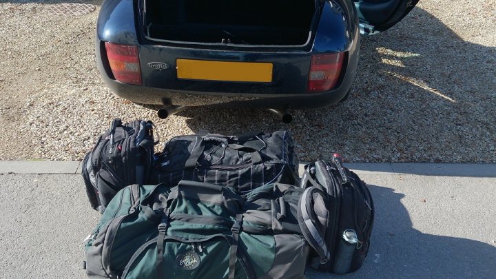 A bag of luggage sitting on the side of a road - Pistonheads