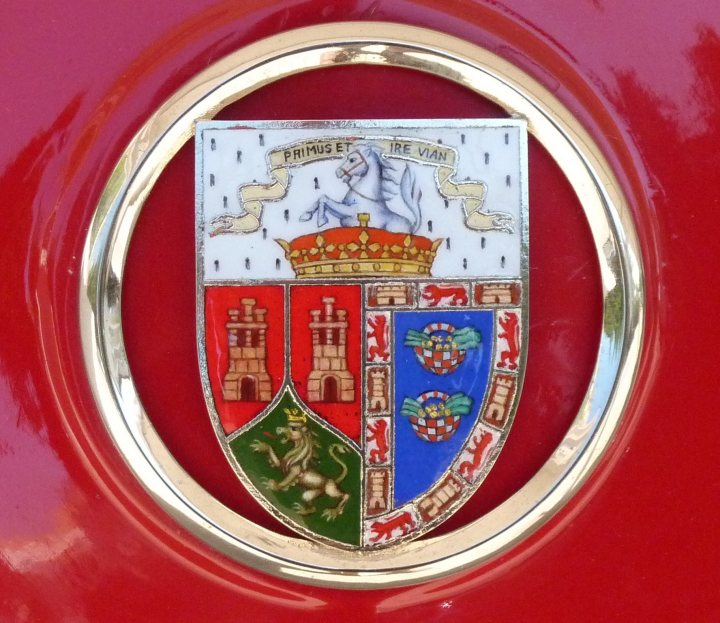A close up of a red and white clock - Pistonheads