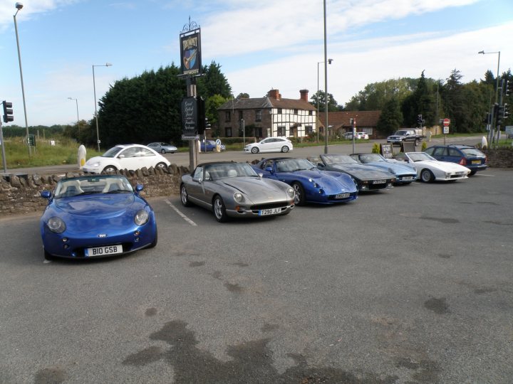 A group of cars parked on the side of the road - Pistonheads