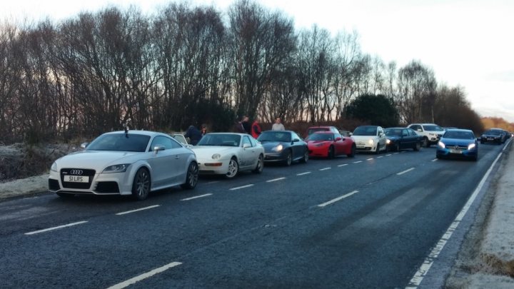 A group of cars that are driving down the street - Pistonheads