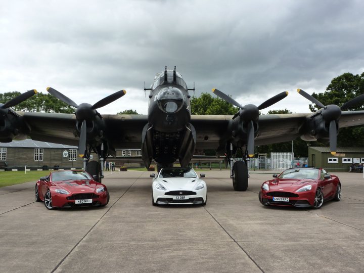 A group of people standing around an airplane - Pistonheads