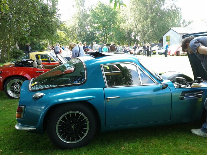 A classic car is parked on the grass - Pistonheads