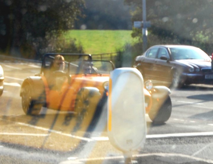 A yellow fire hydrant sitting on the side of a road - Pistonheads
