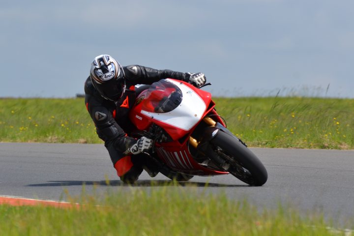 A person riding a motorcycle on a track - Pistonheads
