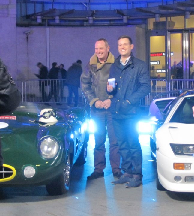 A group of people standing next to a car - Pistonheads