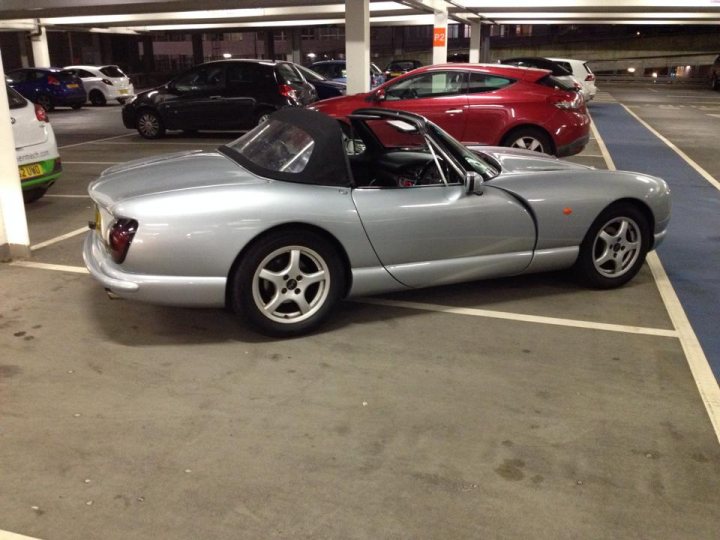 A classic car is parked in a parking lot - Pistonheads
