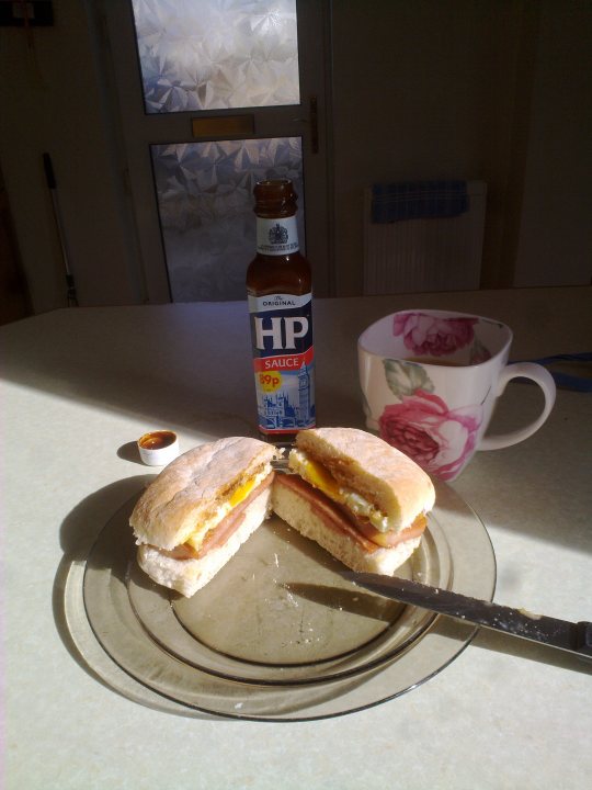 A plate with a sandwich and a cup of coffee - Pistonheads