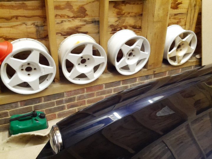 A row of urinals mounted to a wall - Pistonheads