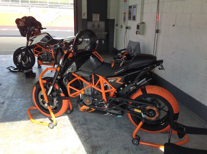 A motorcycle parked in a garage with other motorcycles - Pistonheads