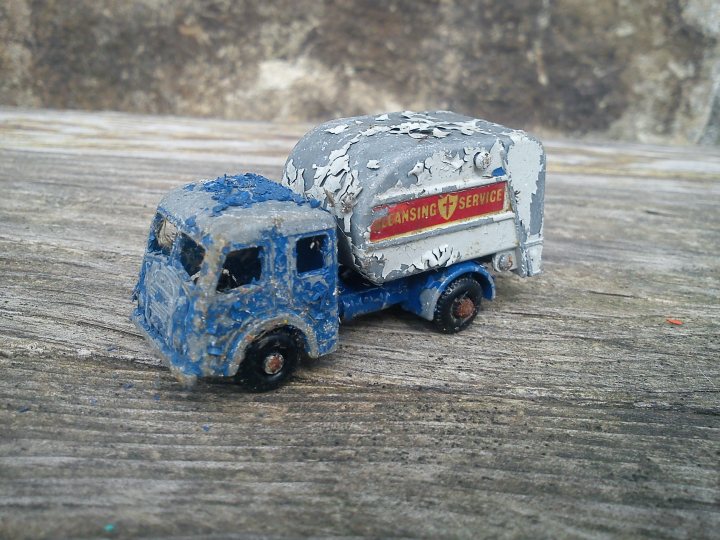 A blue truck is parked in a field - Pistonheads