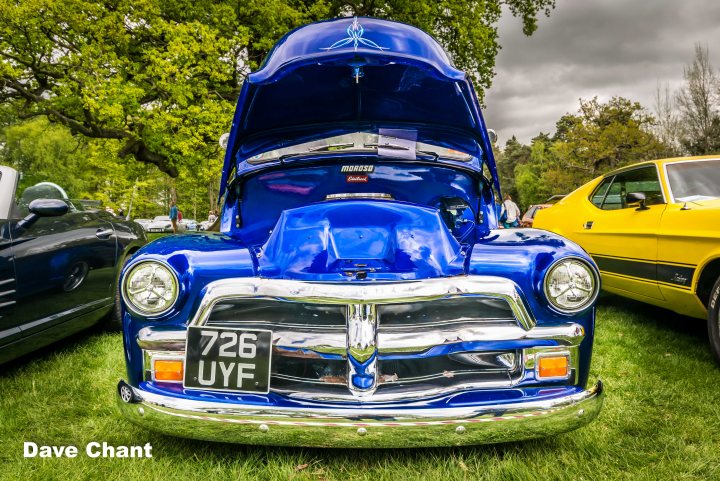 A classic car is parked in a field - Pistonheads