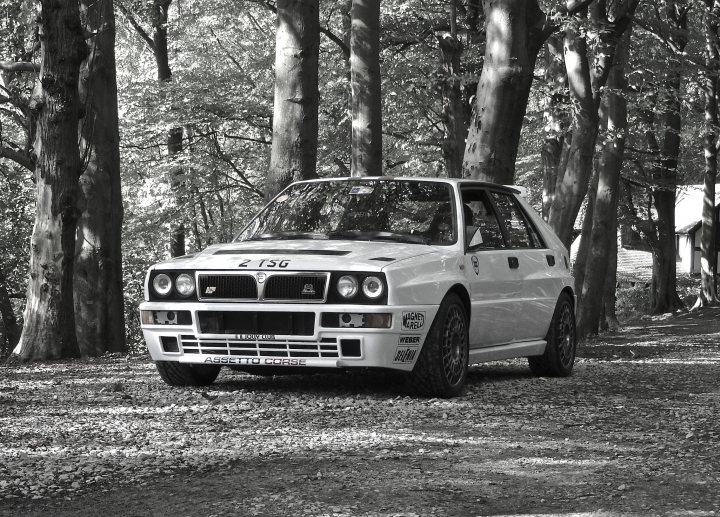 A black and white photo of a car and a car - Pistonheads