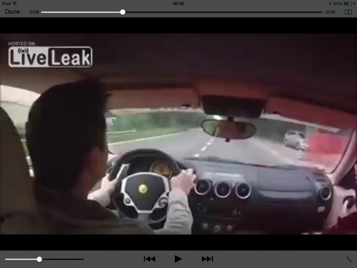 A person taking a picture of a man in a car - Pistonheads