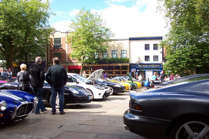 A group of people walking down a street - Pistonheads