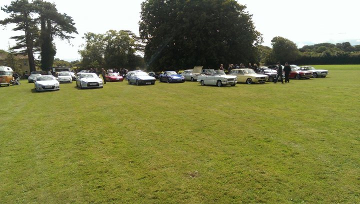 A group of cars parked on the side of a road - Pistonheads