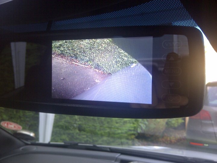A reflection of a dog in the side mirror of a car - Pistonheads