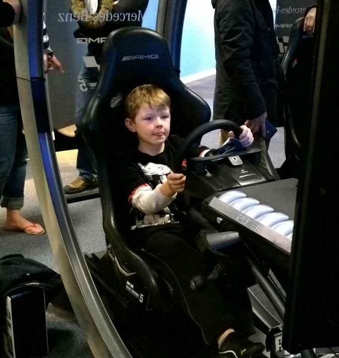 A woman sitting on a train with a child - Pistonheads