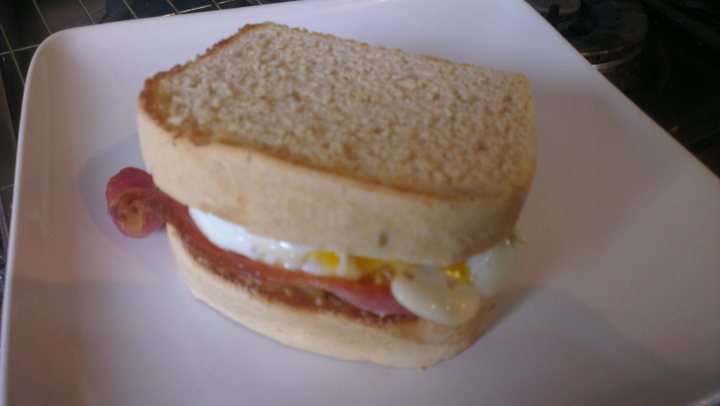 A sandwich cut in half on a white plate - Pistonheads