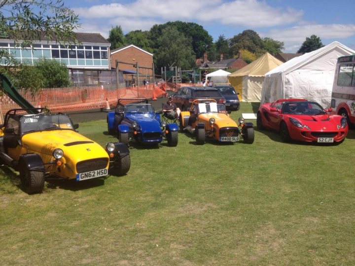 A bunch of cars are parked in a field - Pistonheads