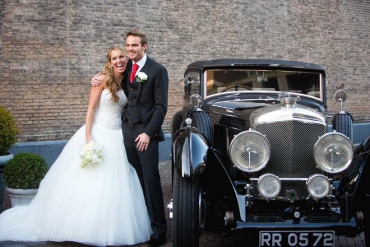 A bride and groom pose for a picture - Pistonheads