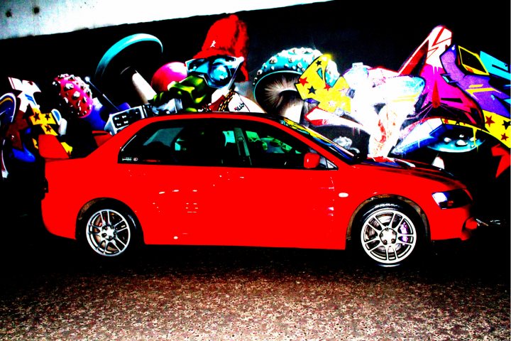 A red car with a large amount of flowers in it - Pistonheads