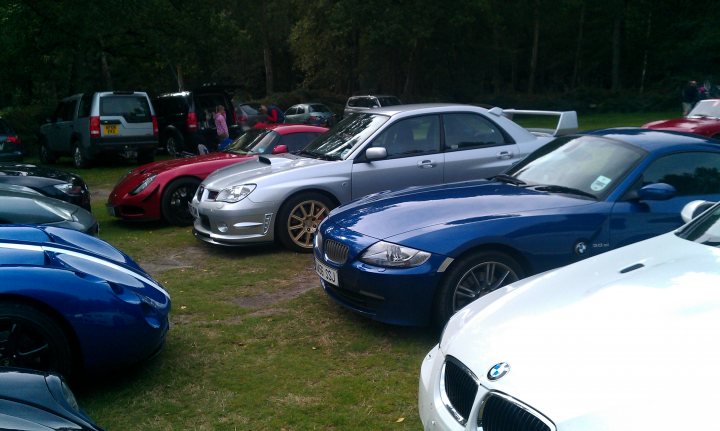 A group of cars parked in a parking lot - Pistonheads