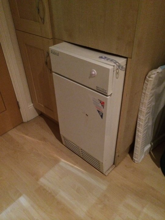 A white refrigerator freezer sitting inside of a kitchen - Pistonheads